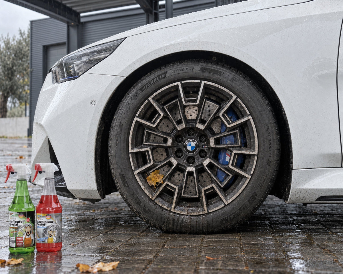 TUGA Chemie Alu-Teufel Spezial and Aluminium-Teufel in front of the dirty front wheel of a white BMW M5