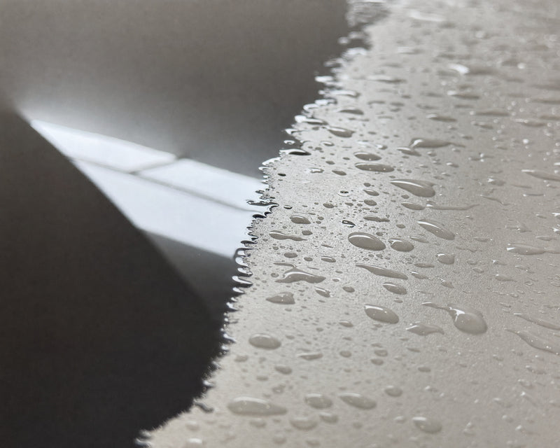 Detailing1 macro of the paint edge: dried area next to standing water beads on the Porsche 911 GT3 RS